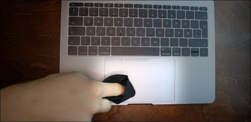 Clean the touchpad surface with a dry soft cloth
