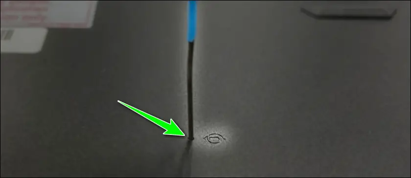 Insert a straightened paperclip into the reset hole